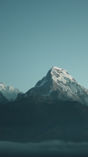 Snow-capped mountains under a clear sky