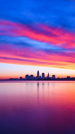 Cleveland skyline at sunset over Lake Erie