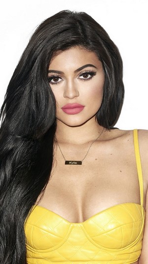 Kylie Jenner wearing a yellow top and necklace