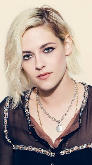 Kristen Stewart with blonde hair and necklaces