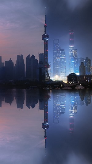 Shanghai skyline with Oriental Pearl Tower reflected in water