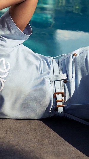Elizabeth Olsen in light blue outfit with belt