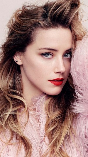 Amber Heard with blonde hair and red lipstick