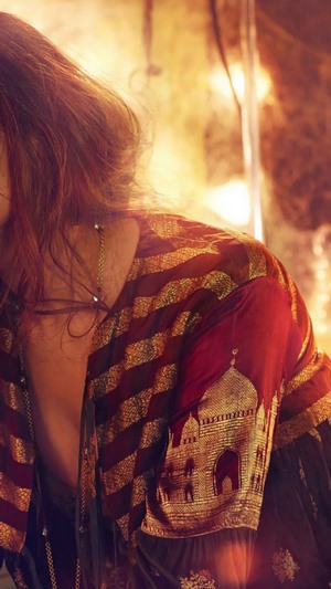 Deepika Padukone in a red and gold outfit