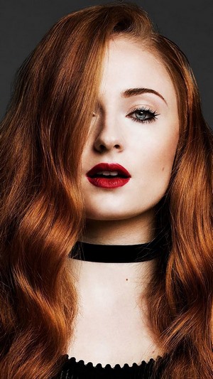 Sophie Turner with red hair and red lipstick