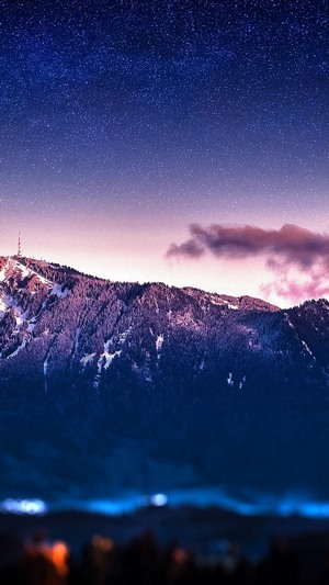Snowy Mountains Under a Starry Night Sky