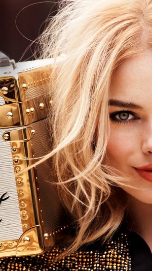 Margot Robbie with Louis Vuitton trunk