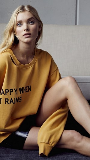 Elsa Hosk wearing a yellow sweatshirt
