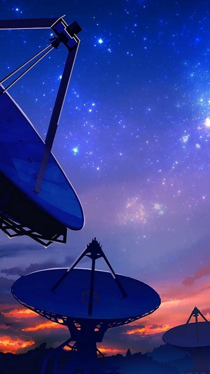 Satellite dishes under a starry night sky