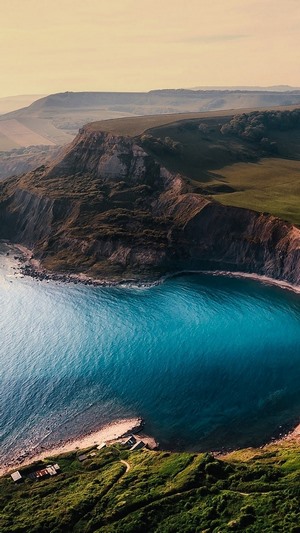 Coastal cliffs overlooking a turquoise bay