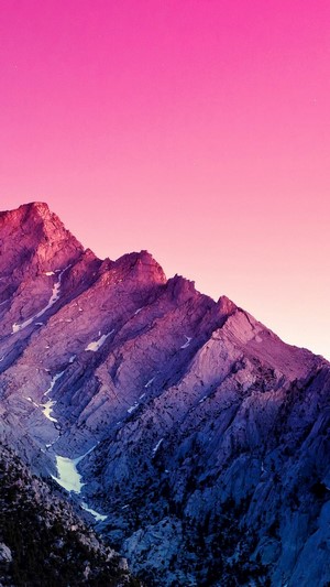 Mountain range under a purple sky