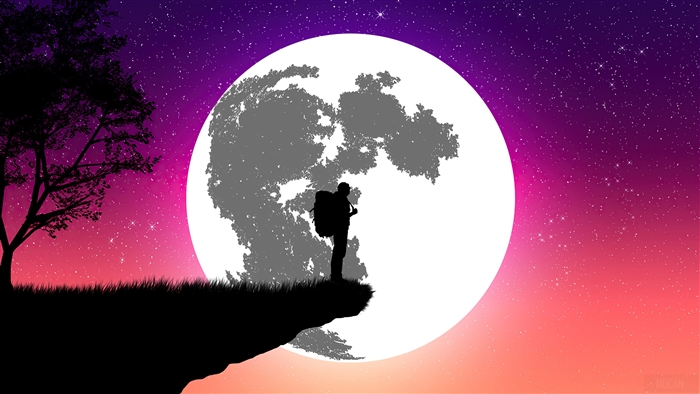 Silhouette of a hiker on a cliff with a large moon