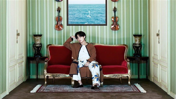 V from BTS in a room with violins
