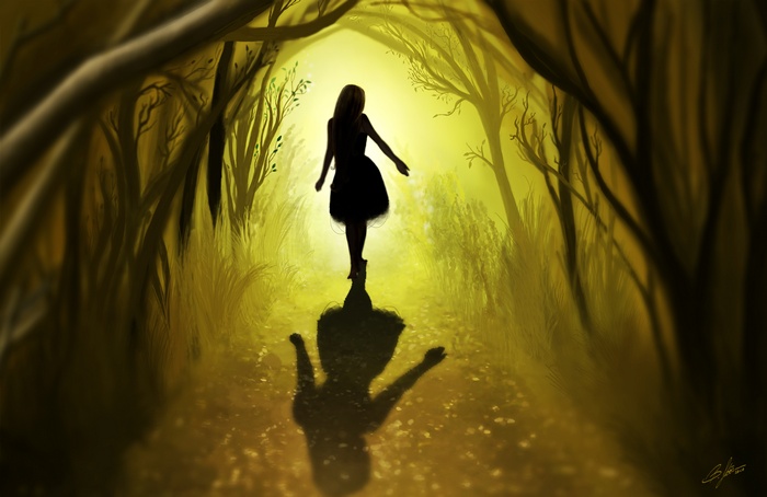 Girl walking on a path through a forest