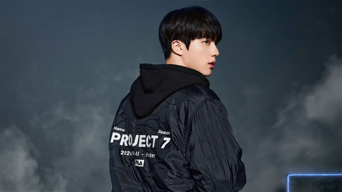 Jin from BTS wearing Fila Project 7 jacket
