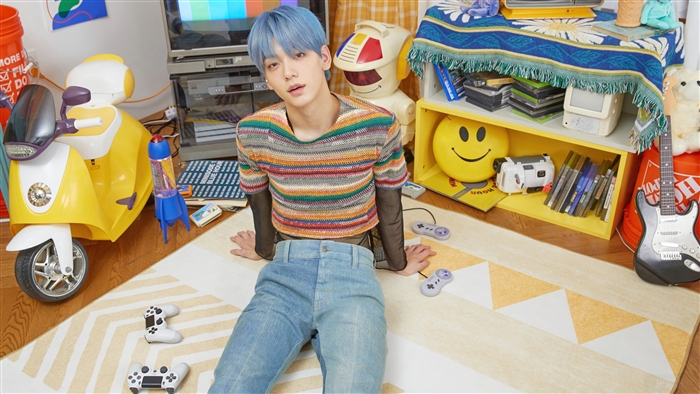 Soobin from TXT in a retro room with toys