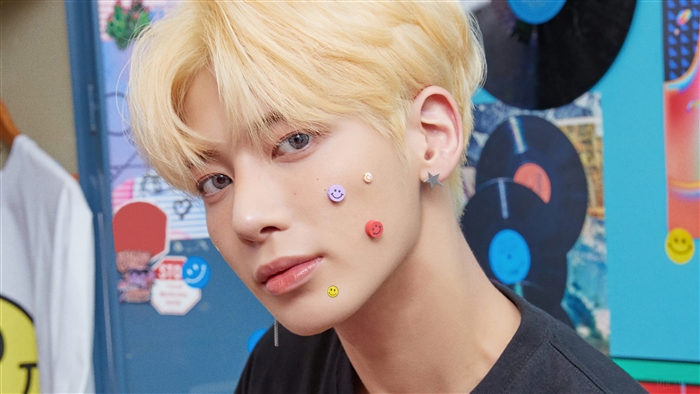 Taehyun from TXT with smiley face stickers