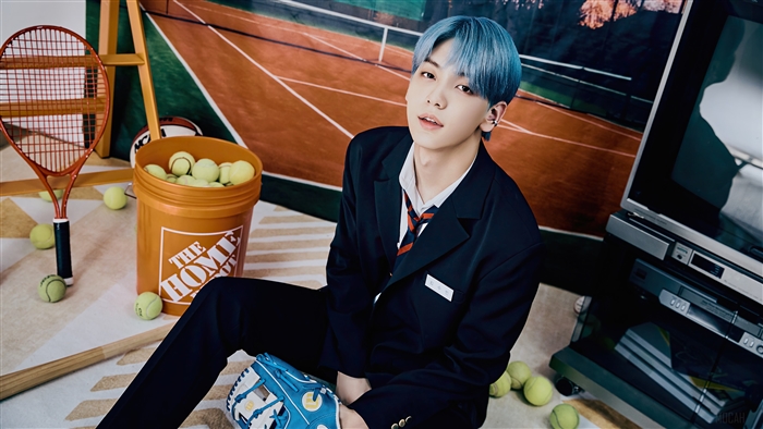 Soobin from TXT in a photoshoot with sports equipment