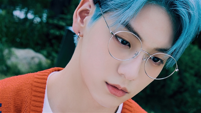 Soobin from TXT wearing glasses in a photoshoot