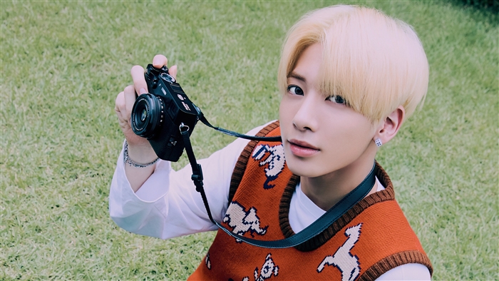 Taehyun from TXT holding a camera