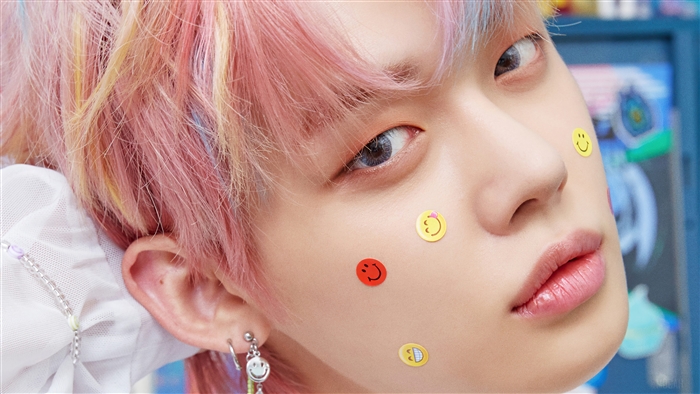 Yeonjun from TXT with smiley face stickers