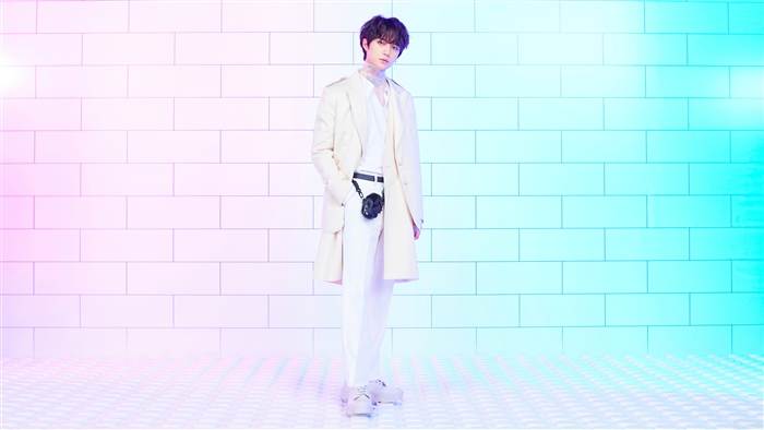 Beomgyu from TXT in a white outfit
