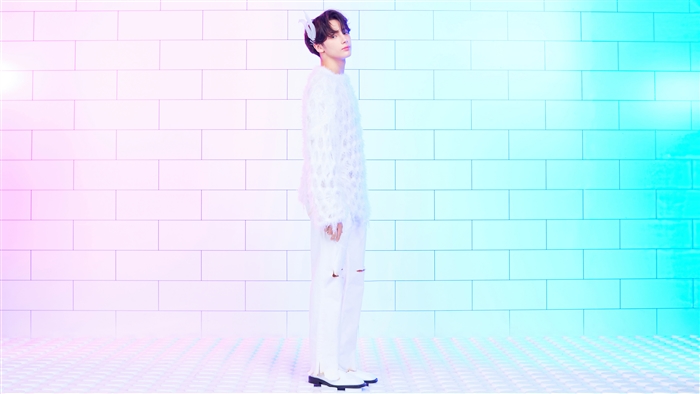 Huening Kai from TXT in white outfit