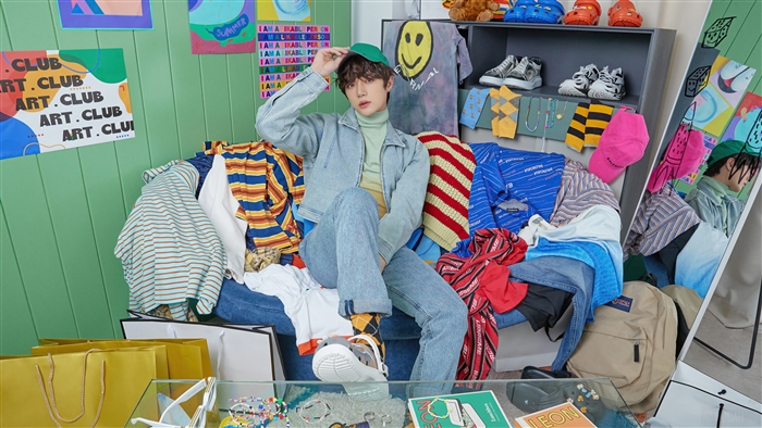 Beomgyu from TXT in a room full of clothes