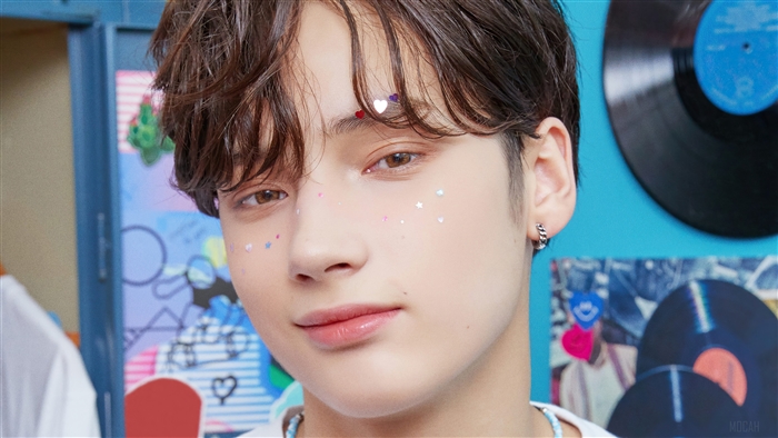 Huening Kai from TXT with glitter on face