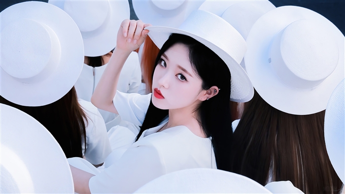 Olivia Hye from Loona wearing a white hat