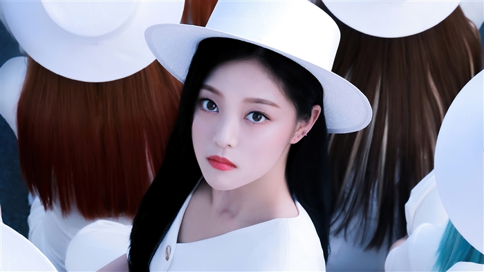 Hyunjin from Loona wearing a white hat