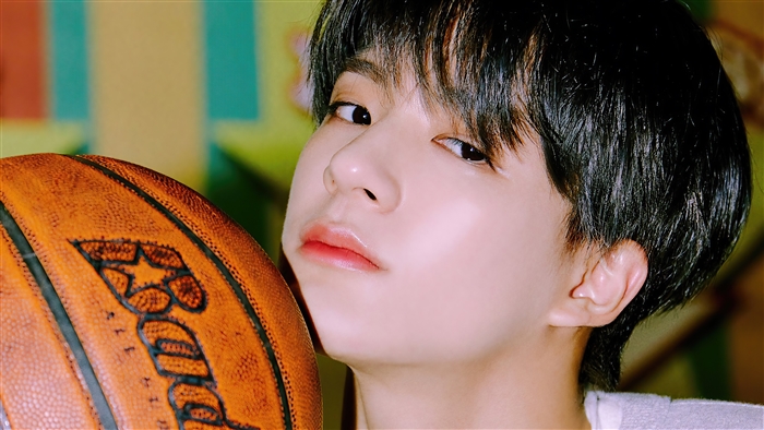 Jeno from NCT Dream with a basketball