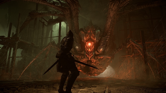 Knight facing a giant spider demon in Demon's Souls