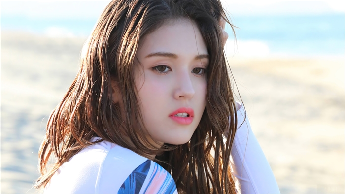 Somi on a beach photoshoot