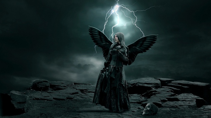 Gothic angel with black wings under lightning storm