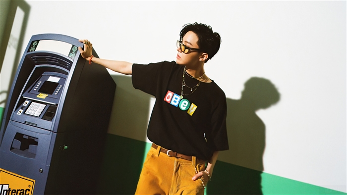 J-Hope from BTS posing by an ATM