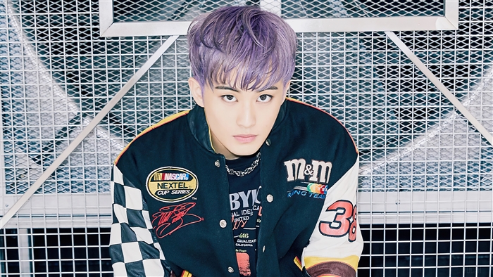 Mark Lee from SuperM wearing a NASCAR jacket