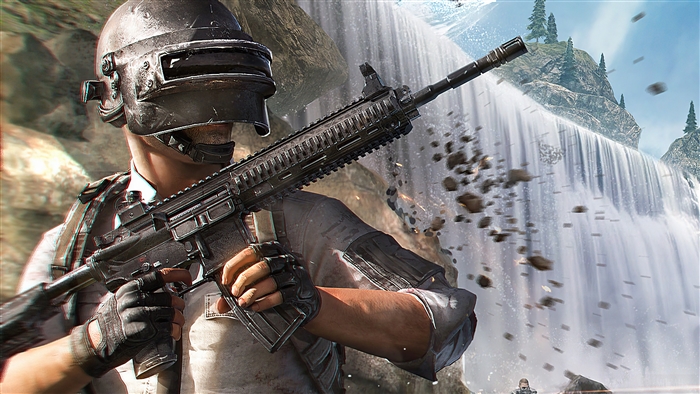 Player in PUBG holding a rifle near a waterfall