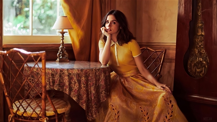 Ana de Armas in a yellow dress during a photoshoot