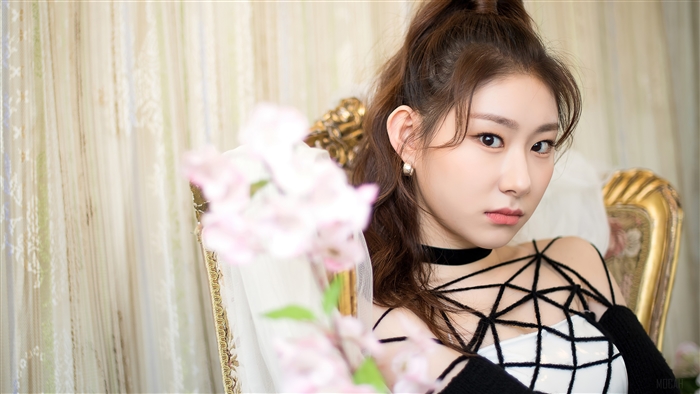 Chaeryeong from ITZY posing on a chair