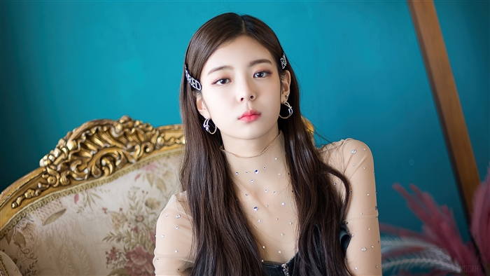 Lia from ITZY posing on a vintage chair