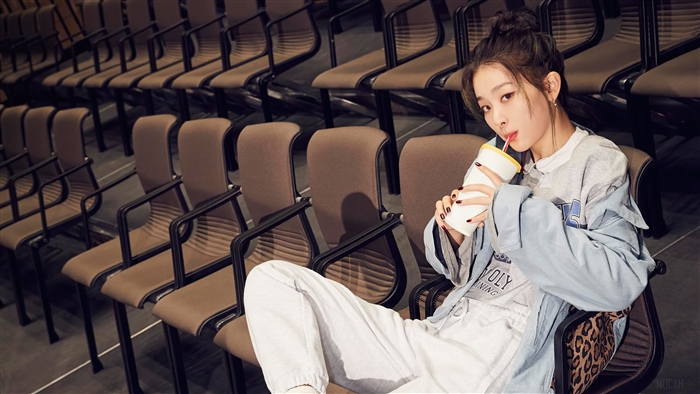Seulgi from Red Velvet drinking from a cup