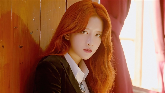 EXY from WJSN posing in a suit