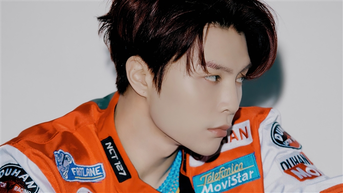 Johnny from NCT 127 wearing a racing jacket