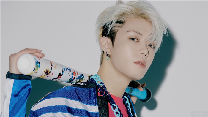 Yuta from NCT 127 holding a baseball bat