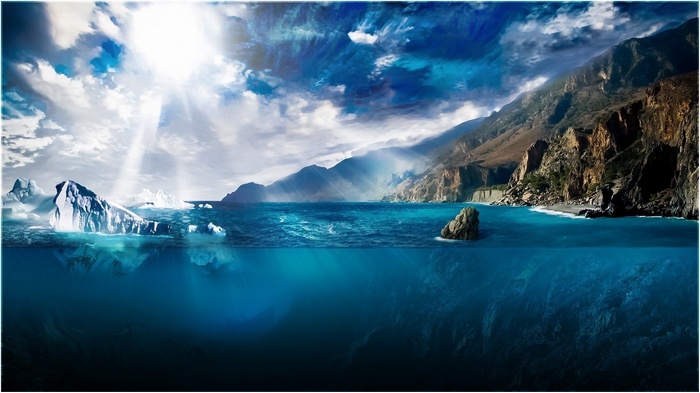 Icebergs and mountains under sunlight