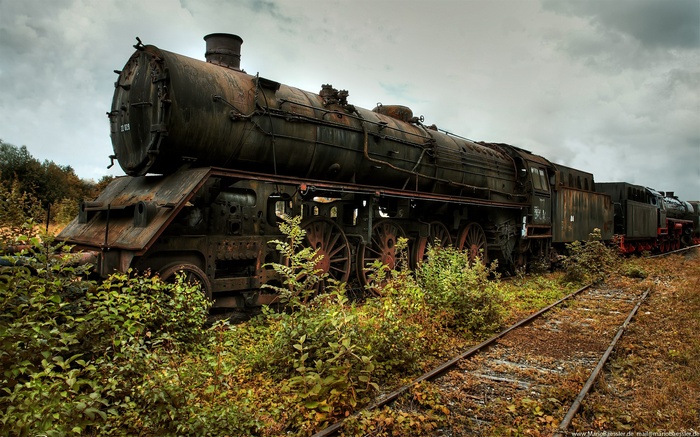 Abandoned Rusted Steam Locomotives on Tracks
