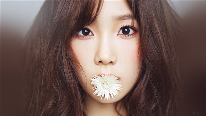 Taeyeon with a white flower in her mouth