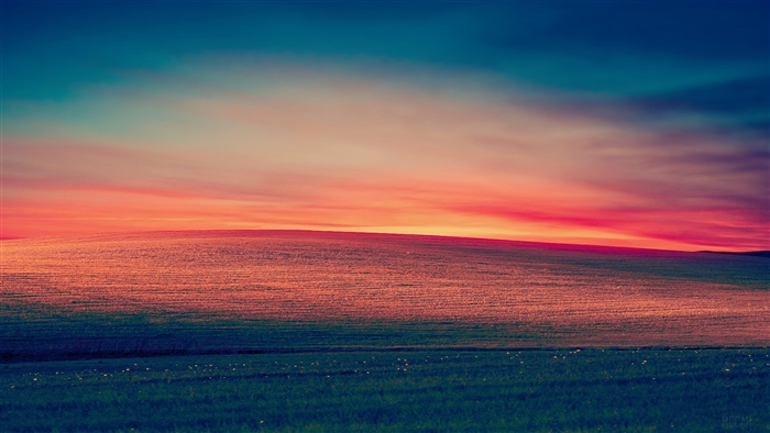 Sunset over rolling hills and grassland 4K