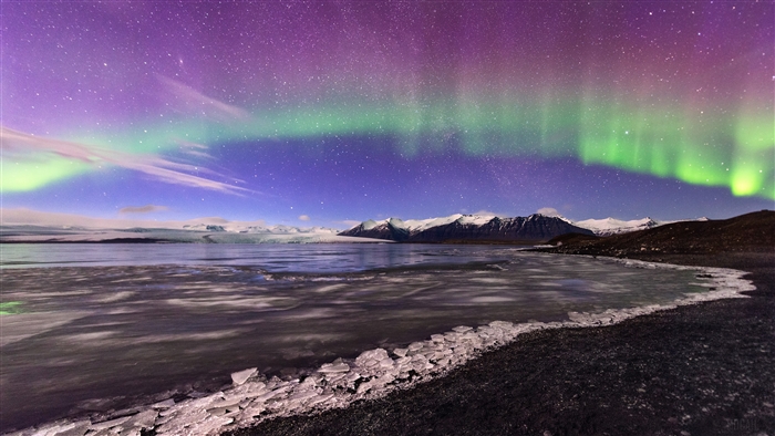 Aurora Borealis over a glacial landscape